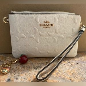 Coach Wristlet Cream Colored with Charms